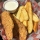 Crispy chicken strips served with thick-cut fries and ranch dipping sauce.