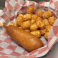 Classic corn dog served with crispy tater tots.