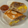 Breakfast burrito filled with country fried steak, eggs, and cheese.