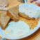 Country fried steak with gravy, eggs and hash browns.