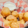Basket of crispy deep-fried mushrooms served with ranch dipping sauce.