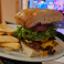 Two 1/3 lb. beef patties charbroiled and topped with American Cheese, smoked bacon, lettuce, tomato, red onion, and house sauce on toasted house bread.