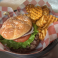 Classic hamburger with lettuce, tomato, red onion, and crisp leaf lettuce served with seasoned waffle fries.