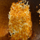 Golden brown crispy shredded hash browns.