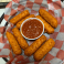 Golden fried mozzarella sticks served with marinara sauce.