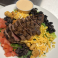 Grilled steak sliced over a fresh garden salad with cheese, tomatoes, olives, corn, black beans, and house dressing.