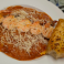 Cheese ravioli in spicy marinara with grilled shrimp, Parmesan, and garlic bread.