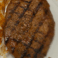 Grilled steak served as a dinner add-on.