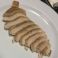 Sliced seasoned chicken breast side portion.