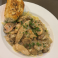 Spaghetti topped with chicken and mushroom Marsala sauce, served with garlic bread.