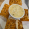 Creamy spinach artichoke dip topped with parmesan and served with toasted bread.