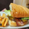 1/2 lb. beef patty charbroiled and topped with smoked bacon, cheddar cheese, lettuce, tomato, red onion, and mayo on toasted house bread.